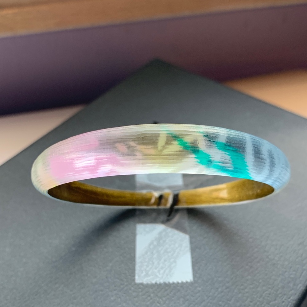 Alexis Bittar tapered bangle bracelet.